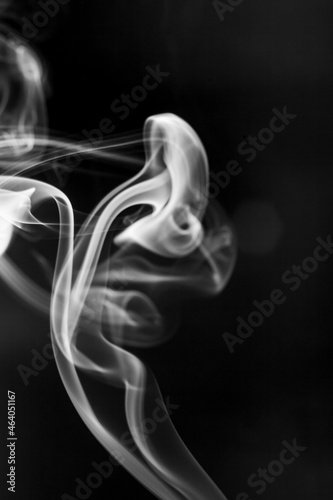 White smoke motion on black background.