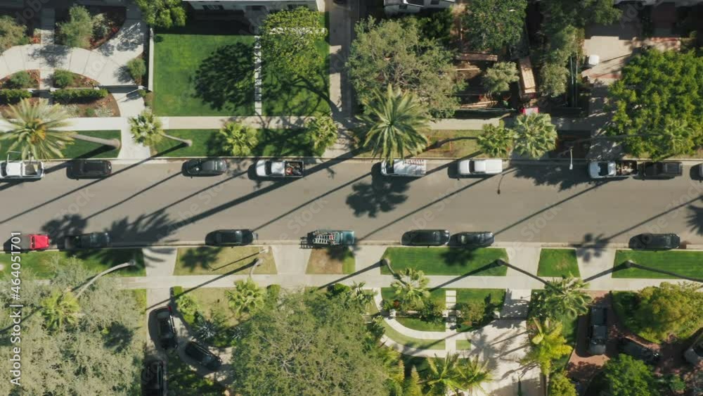 Aerial top down view on city street in prestige neighborhood area with big houses mansions in luxury Beverly Hills district, Los Angeles suburban area. Overhead view on Palm avenue and parked cars USA Aerial top down view on city street in prestige neighborhood area with big houses mansions in luxury Beverly Hills district, Los Angeles suburban area. Overhead view on Palm avenue and parked cars USA