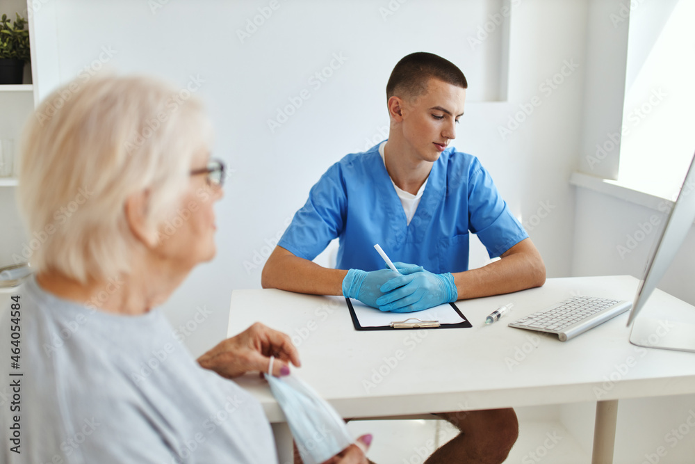 elderly woman talking to doctor professional consultant elderly woman talking to doctor professional consultant