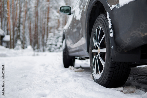 close-up of a car wheel on a snowy road