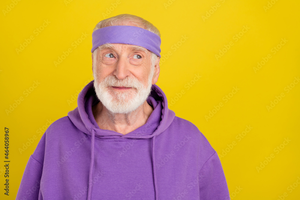 Photo of senior man interested wonder dreamy plan minded look empty space isolated over yellow color background