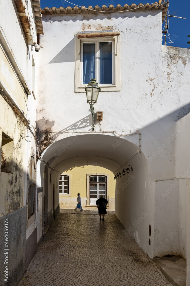 alleyway, arches and lampposts in Lagos, Algarve Portugal	