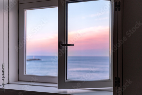Sunrise over Atlantic Ocean through the open window