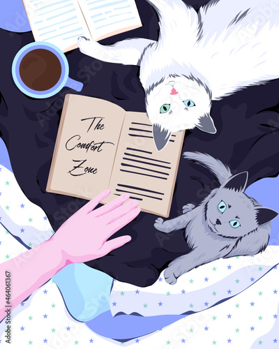 Reading a book with cats
