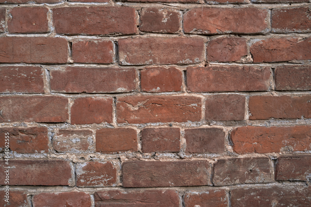 Fototapeta premium Old brick wall, old texture of red stone blocks closeup