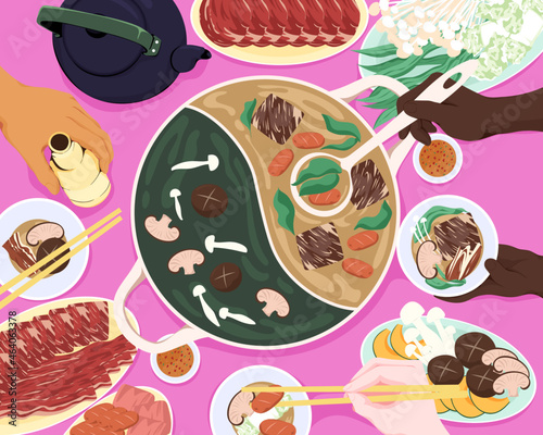 Overhead of people eating asian meat hotpot