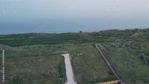 Seascape with clay coast beach on a steep bank. Ukraine, Odessa region, Sanzheyka. View from the drone. photo