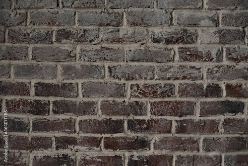 Old brick wall. Brickwork from an red old brick in a rustic style. The structure and pattern of the stone wall. Copy space.