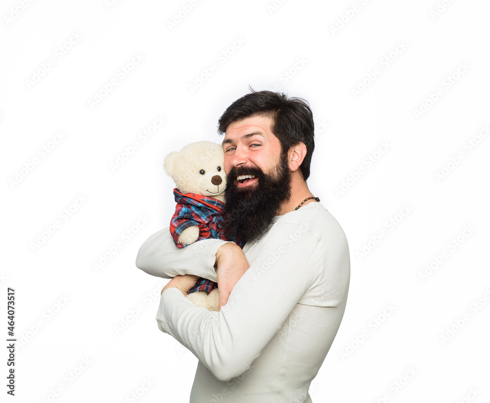 Bearded man hugging teddy bear. Gift and present concept. Happy man with plush toy. Fashion and style. Birthday or anniversary and holiday celebration. Teddy bear present. Happy man with teddy bear. Bearded man hugging teddy bear. Gift and present concept. Happy man with plush toy. Fashion and style. Birthday or anniversary and holiday celebration. Teddy bear present. Happy man with teddy bear.