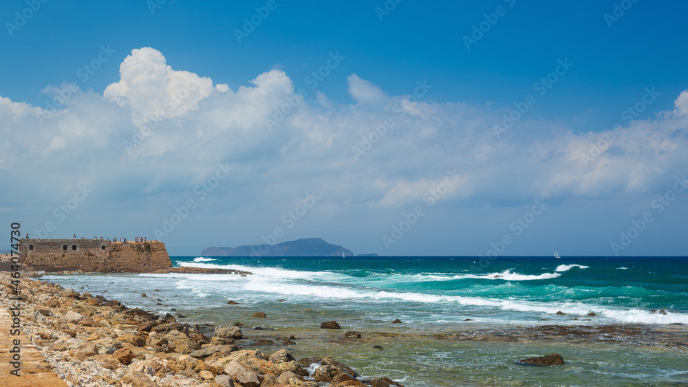 sea landscape with waves and blue sky with white clouds