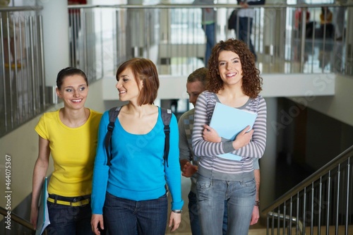 Smiling university students on staircase