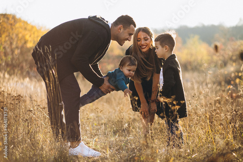 Young family with two sons together in park