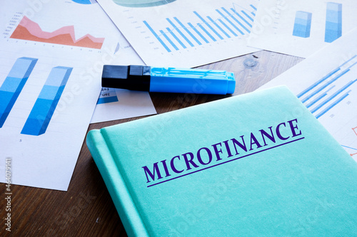  MICROFINANCE phrase on the notepad. photo