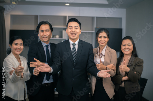 Portrait of businesspeople standing with arms crossed in office