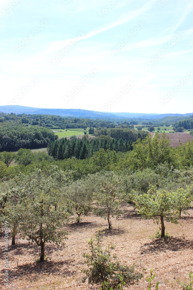 Beautiful wide view over the French mountainous landscape of the Dordogne. Photo was taken on a hot day in summer. Beautiful wide view over the French mountainous landscape of the Dordogne. Photo was taken on a hot day in summer.