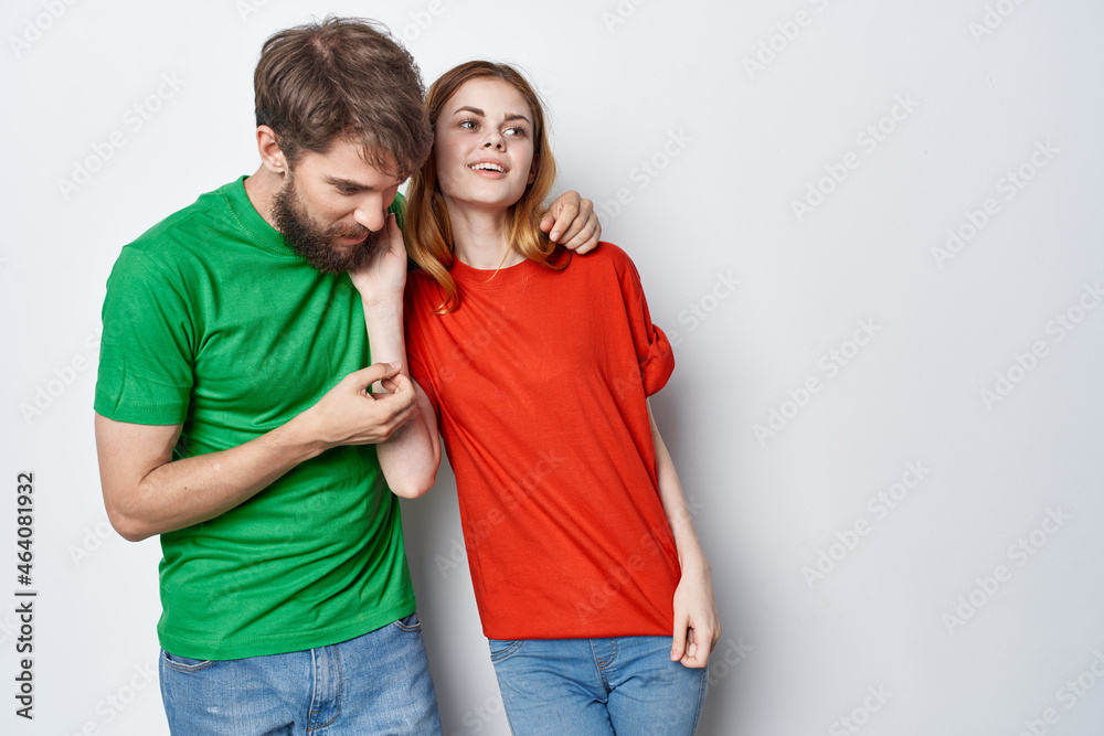 man and woman hug friendship colorful t-shirts family studio lifestyle man and woman hug friendship colorful t-shirts family studio lifestyle
