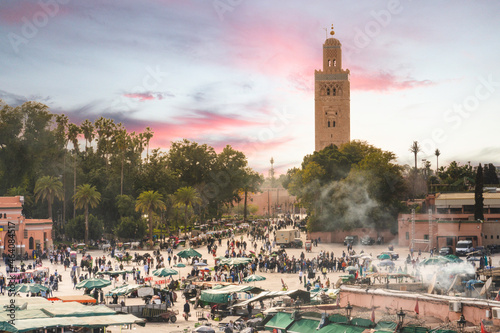 view of Koutoubia Mosque and Jamaa El Fna square crowded © Morocko