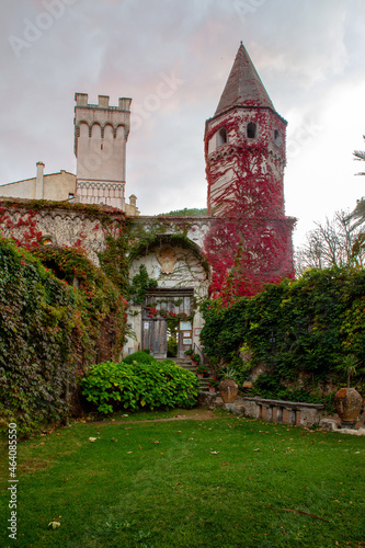 Bild auf Leinwand The tower of the old villa Cimbrone (, entwined with red ivy - the beginning of autumn in southern Italy (Campania)