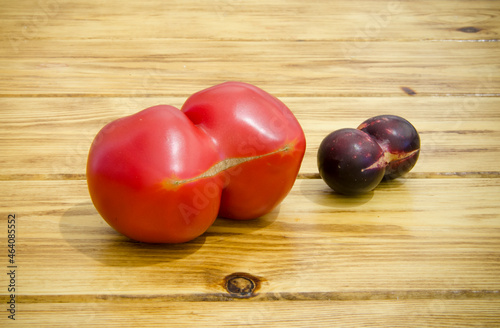 Freak fruits. Double tomato and double cherry plum