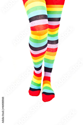 legs of a woman with colorful raibow high socks