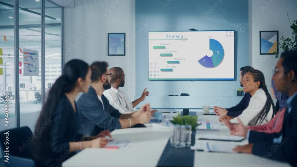 Multi-Ethnic Office Conference Room Meeting: Diverse Team of Managers, Executives Talk, Uses Wall TV with Big Data Analysis, Charts and Infographics. Businesspeople Investing in e Commerce Startup