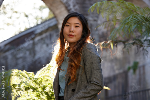 Young Asian woman enjoying time outdoors at enclave photo