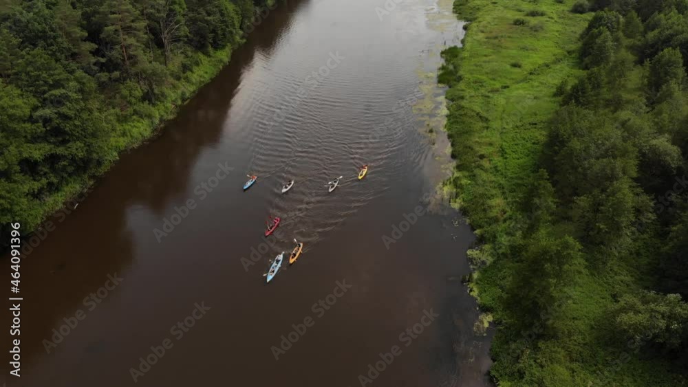 Aerial flight over a group of kayaks floating along the river in a wedge Aerial flight over a group of kayaks floating along the river in a wedge
