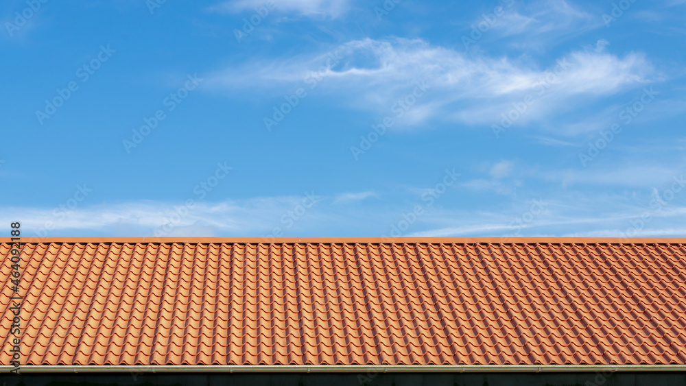 Orange brick rooftop under blue sky and white cloud, Tiles background details, Shingles texture, Abstract geometric pattern, Roof brick material. Orange brick rooftop under blue sky and white cloud, Tiles background details, Shingles texture, Abstract geometric pattern, Roof brick material.