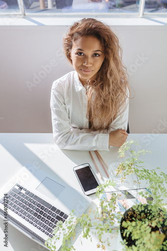 Accomplished looking professional young woman at her desk