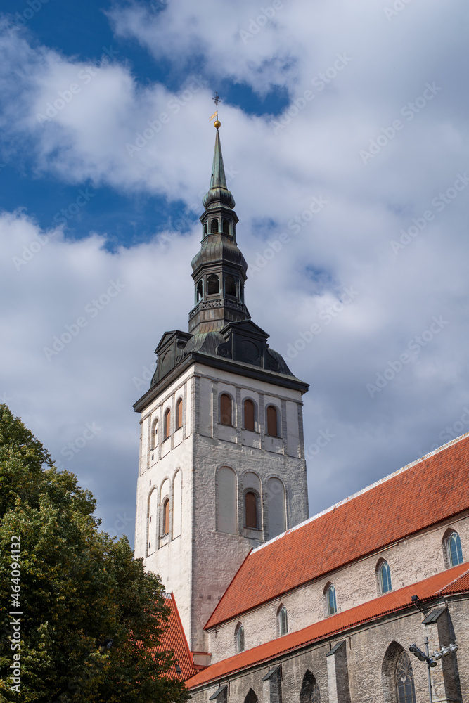 The steeple of St. Nicholas' Church (Niguliste) on a sunny autumn day. Tallinn, Estonia.