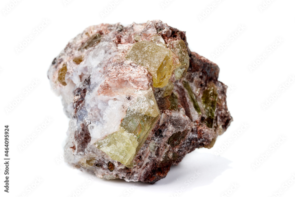 Macro mineral stone.Golden Apatite on a white background