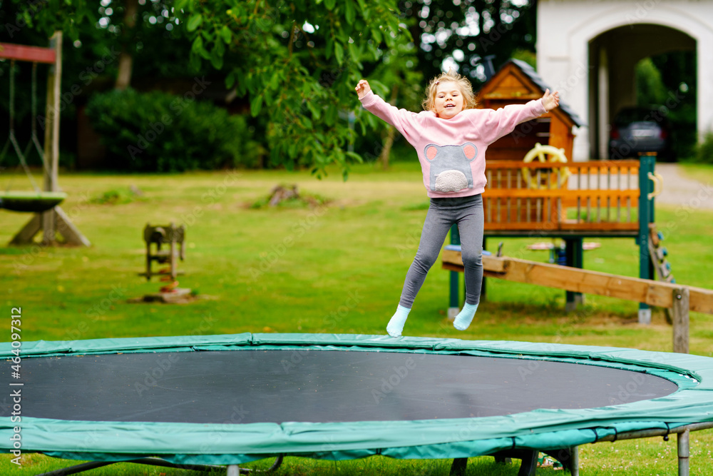 Happy preschool kid jumping on trampoline Vector Image