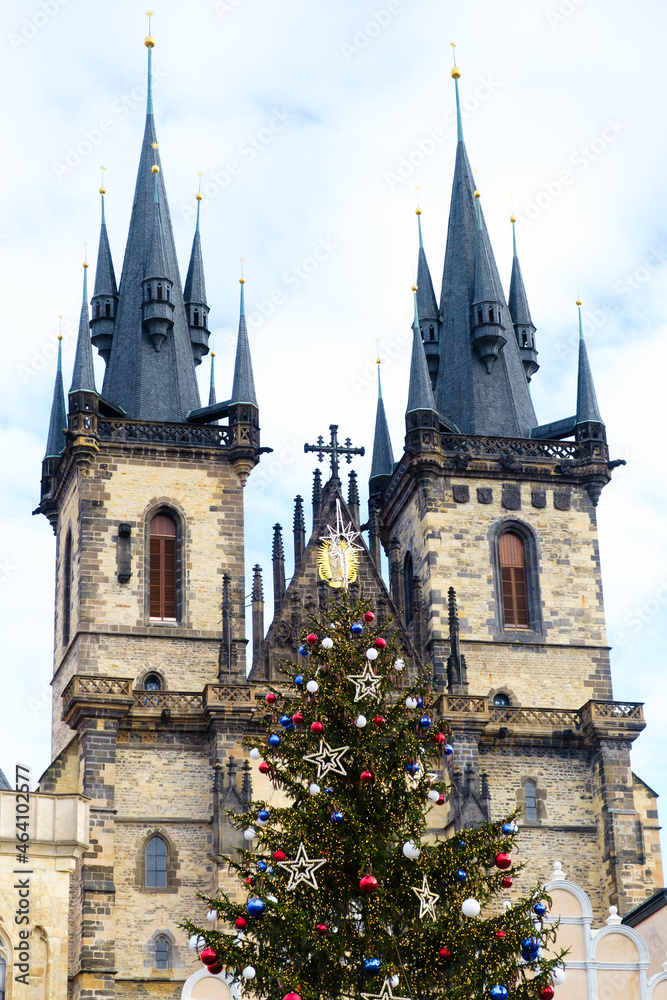 Christmas tree with colorful balls in Old Town in Prague on the background of The Church of Mother of God before Tyn. Preparing for the Christmas market