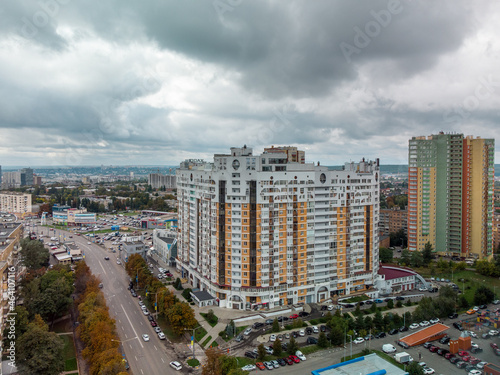 Multistory modern high residential buildings on Nauky ave, cityscape aerial view. Kharkiv city Pavlovo Pole district with epic dark clouds photo