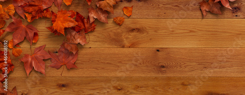 Top down view of Natural wood Tabletop with leaves.