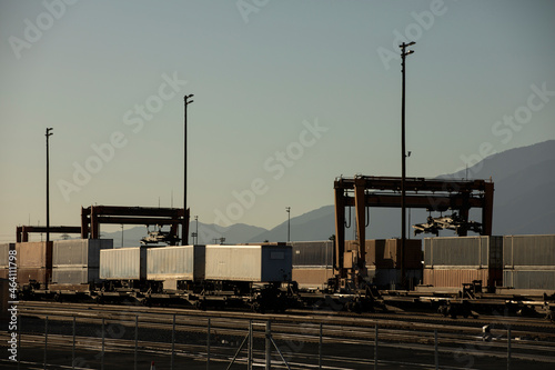 San Bernardino, California, USA - October 10, 2021: A late afternoon cargo stack train arrives at an intermodal facility to be unloaded.