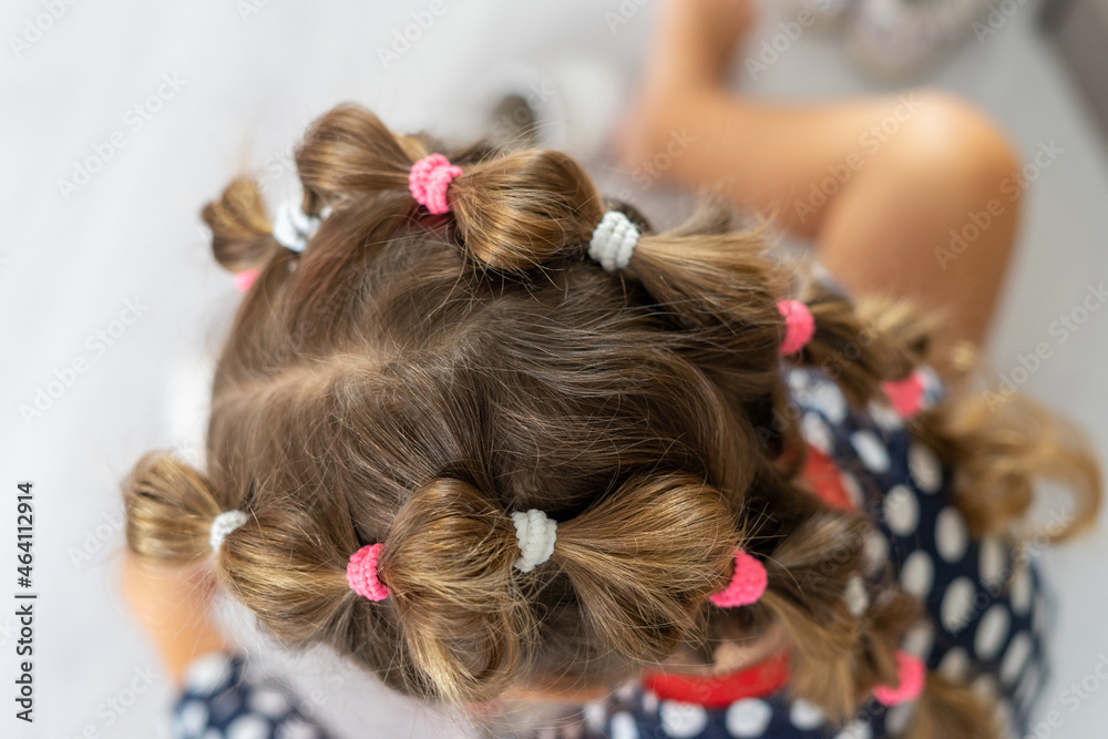 Fototapeta premium A beautiful hairstyle on the girl's head.
