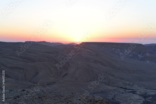 Mountain landscape  desert. Makhtesh Ramon Crater in Negev desert  Israel. Stony desert panoramic view. Unique relief geological erosion land form. National park Makhtesh Ramon or Ramon Crater