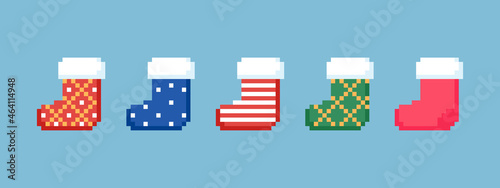 Pixel art Christmas socks collection. Set of 8 bit video game decoration stocking elements. Christmas red, blue, green gift socks. Vector isolated vintage icons.
