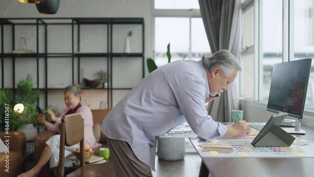 old asian senior retired age working at home hand ise desktop and paper document at working desk in living room home interior background,asian male senior work at home old asian senior retired age working at home hand ise desktop and paper document at working desk in living room home interior background,asian male senior work at home