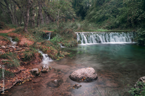 Fototapeta Naklejka Na Ścianę i Meble -  Forest in autumn with long exposure waterfall in bejis, valencia. Brown, green