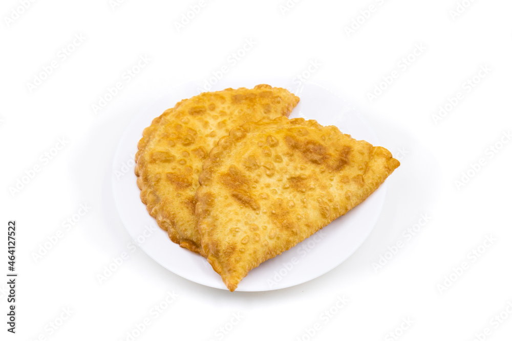 Chebureks on a white background. Caucasian cuisine. Chebureks on a white background. Caucasian cuisine.