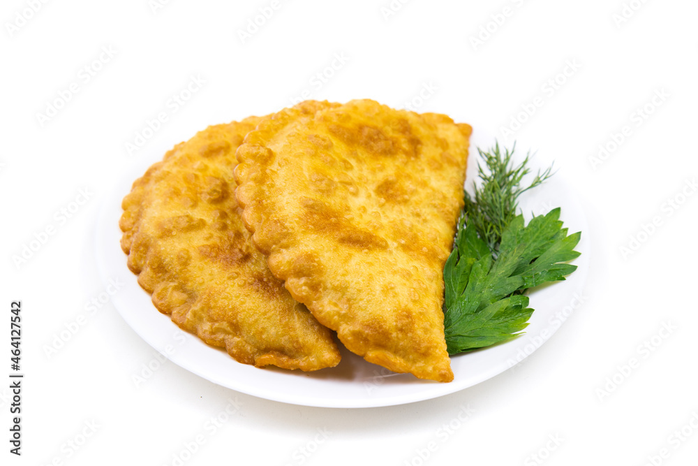 Chebureks on a white background. Caucasian cuisine. Chebureks on a white background. Caucasian cuisine.