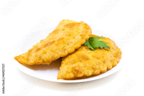 Chebureks on a white background. Caucasian cuisine.
