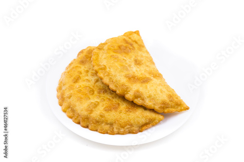 Chebureks on a white background. Caucasian cuisine.