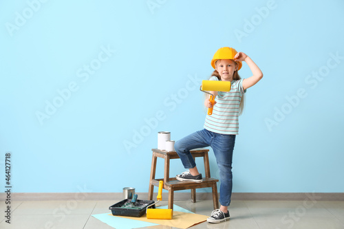 Little girl in hardhat with...