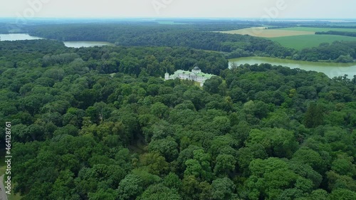 Aerial view palace in kachanivka, beautiful nature forest and lake. Drone wide shot park and river photo