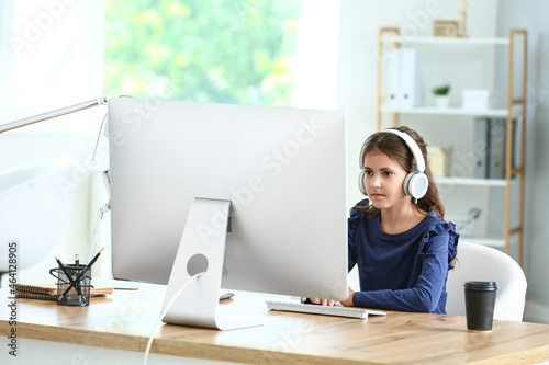 Cute little programmer usin...