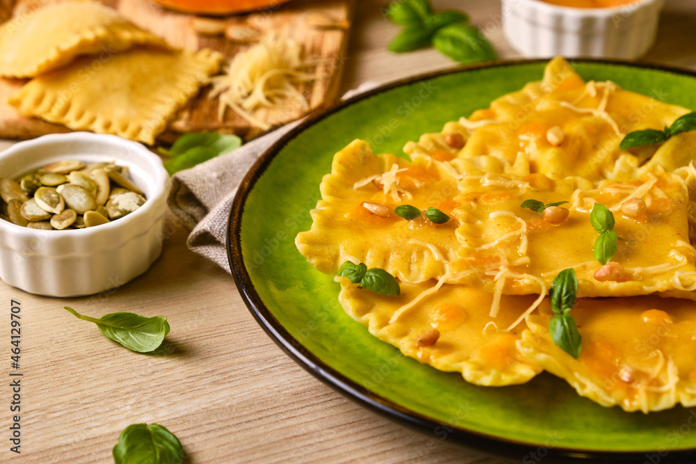 Homemade Pumpkin Ravioli with ricotta cheese served basil