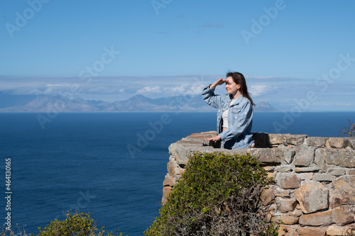 Young woman standing at view point and looking forward